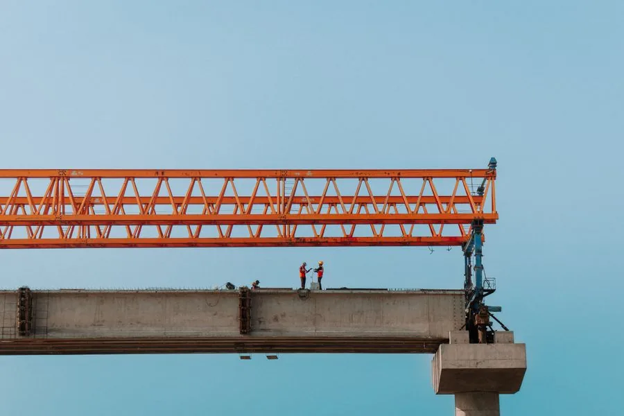 A crew working together on a bridge in Chilmari, Bangladesh