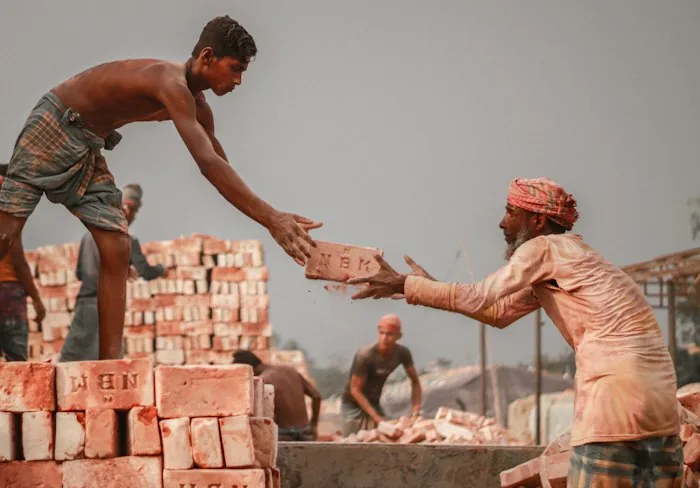A labourer working outdoors in the heat